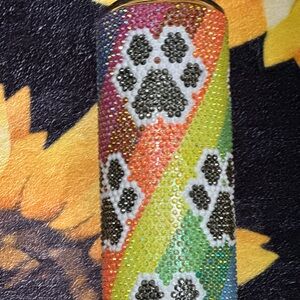 20 oz rhinestone tumbler with paw prints.